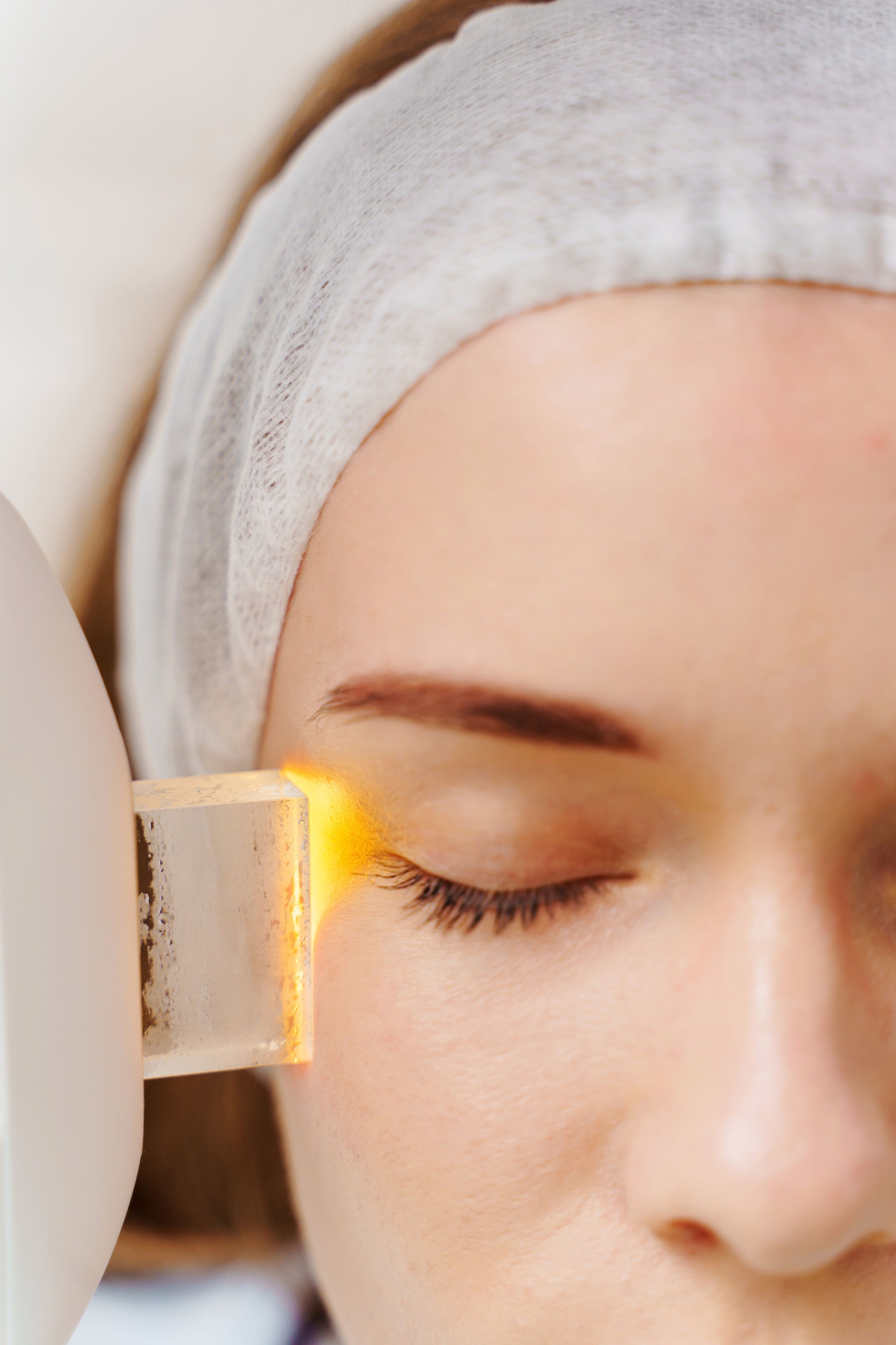 IPL face pigmentation therapy by beautician. Ultrasound laser facial pigmentation treatment in medicine center. Care after skin pigmentation procedure.